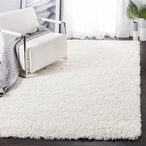 SAFAVIEH Flokati Lavena Solid Polyester Shag Area Rug, Ivory, 5'3*7'6